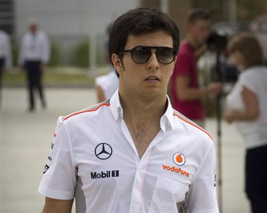 McLaren Formula One driver Sergio Perez of Mexico arrives in the paddock at the Bahrain International Circuit April 18, 2013. REUTERS/Caren McLaren Formula One driver Sergio Perez of Mexico arrives in the paddock at the Bahrain International Circuit April 18, 2013. REUTERS/Caren
