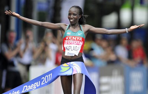 Edna Kiplagat of Kenya celebrates as she wins the women's marathon final at the IAAF World Championships in Daegu August 27, 2011. REUTERS/D Edna Kiplagat of Kenya celebrates as she wins the women's marathon final at the IAAF World Championships in Daegu August 27, 2011. REUTERS/D
