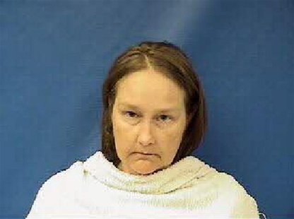 Kim Williams, the wife of the former Kaufman County, Texas, justice of the peace, is shown in this booking photo released on April 17, 2013. Kim Williams, the wife of the former Kaufman County, Texas, justice of the peace, is shown in this booking photo released on April 17, 2013.