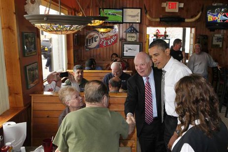 U.S. President Barack Obama stands next to U.S. Sen. Ben Cardin (D-Md) while greeting customers at the Texas Ribs & BBQ restaurant in Clinto U.S. President Barack Obama stands next to U.S. Sen. Ben Cardin (D-Md) while greeting customers at the Texas Ribs & BBQ restaurant in Clinto