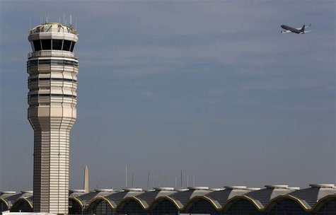 A jet departs Washington's Reagan National Airport next to the control tower outside Washington, in this February 25, 2013 file photo. REUTE A jet departs Washington's Reagan National Airport next to the control tower outside Washington, in this February 25, 2013 file photo. REUTE