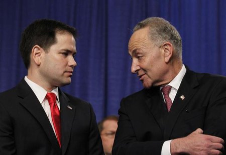 Members of the U.S. Senate's "Gang on Eight" (L-R) Chuck Schumer (D-NY) and Marco Rubio (R-FL) chat during a news briefing on Capitol Hill i Members of the U.S. Senate's "Gang on Eight" (L-R) Chuck Schumer (D-NY) and Marco Rubio (R-FL) chat during a news briefing on Capitol Hill i