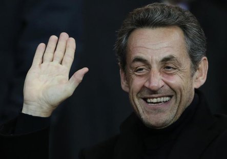 Former French President Nicolas Sarkozy waves as he attends the Champions League quarter-final first leg soccer match where Paris St Germain Former French President Nicolas Sarkozy waves as he attends the Champions League quarter-final first leg soccer match where Paris St Germain