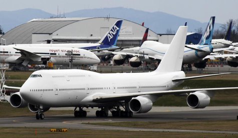 Boeing 747-8 Intercontinental jetliner the company's first VIP-configured aircraft, taxis past Boeing's widebody jetliner production facilit Boeing 747-8 Intercontinental jetliner the company's first VIP-configured aircraft, taxis past Boeing's widebody jetliner production facilit