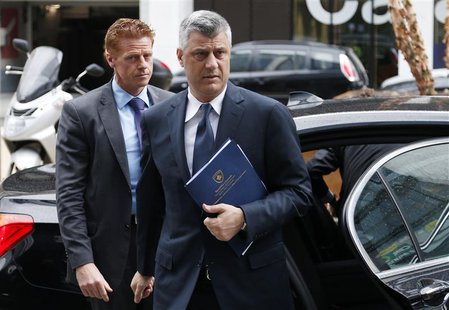 Kosovo's Prime Minister Hashim Thaci (C) arrives for a meeting with Serbian Prime Minister Ivica Dacic (not pictured) and European Union for Kosovo's Prime Minister Hashim Thaci (C) arrives for a meeting with Serbian Prime Minister Ivica Dacic (not pictured) and European Union for