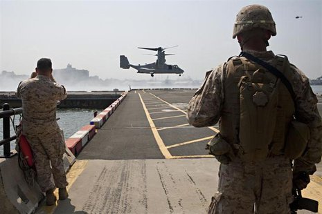 The V-22 Osprey arrives for the Marines from the 1st Battalion 9th Marines Charlie Company 2nd Platoon during a tactical demonstration as a The V-22 Osprey arrives for the Marines from the 1st Battalion 9th Marines Charlie Company 2nd Platoon during a tactical demonstration as a