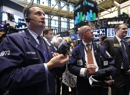 Traders work on the floor at the New York Stock Exchange, April 19, 2013. REUTERS/Brendan McDermid Traders work on the floor at the New York Stock Exchange, April 19, 2013. REUTERS/Brendan McDermid