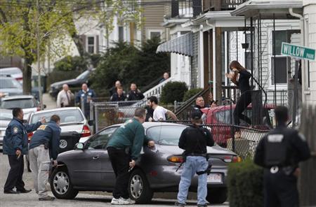 Boston area police officers search home Boston area police officers search home