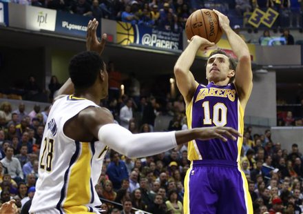 Los Angeles Lakers guard Steve Nash (10) of Canada shoots the basketball over Indiana Pacers center Ian Mahinmi of France during the first h Los Angeles Lakers guard Steve Nash (10) of Canada shoots the basketball over Indiana Pacers center Ian Mahinmi of France during the first h