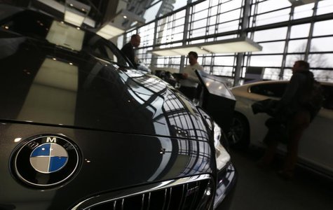 Customers walk around cars of German premium automaker BMW at the headquarters in Munich March 19, 2013. REUTERS/Michael Dalder Customers walk around cars of German premium automaker BMW at the headquarters in Munich March 19, 2013. REUTERS/Michael Dalder