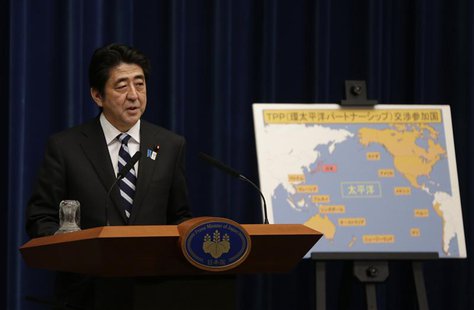 Japan's Prime Minister Shinzo Abe speaks next to a map showing participating countries in rule-making negotiations for the Trans-Pacific Par Japan's Prime Minister Shinzo Abe speaks next to a map showing participating countries in rule-making negotiations for the Trans-Pacific Par