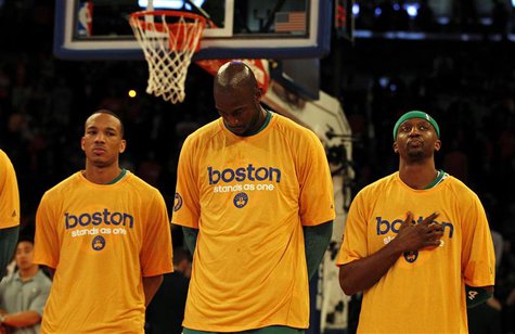 Boston Celtics center Kevin Garnett (C) stands with his teammates during the national anthem wearing "Boston stand as one" t-shirts before t Boston Celtics center Kevin Garnett (C) stands with his teammates during the national anthem wearing "Boston stand as one" t-shirts before t
