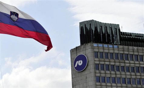 Slovenia's national flag flutters next to Nova Ljubljanska Banka (NLB) building in Ljubljana, July 23, 2012. REUTERS/Srdjan Zivulovic Slovenia's national flag flutters next to Nova Ljubljanska Banka (NLB) building in Ljubljana, July 23, 2012. REUTERS/Srdjan Zivulovic