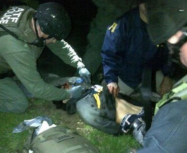 Dzhokhar Tsarnaev, 19, is searched by law enforcement officers in this handout photo provided by the Massachusetts State Police in Watertown Dzhokhar Tsarnaev, 19, is searched by law enforcement officers in this handout photo provided by the Massachusetts State Police in Watertown