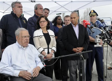 Boston Mayor Tom Menino speaks from his wheelchair during a news conference, as Massachusetts Governor Deval Patrick and public safety offic Boston Mayor Tom Menino speaks from his wheelchair during a news conference, as Massachusetts Governor Deval Patrick and public safety offic