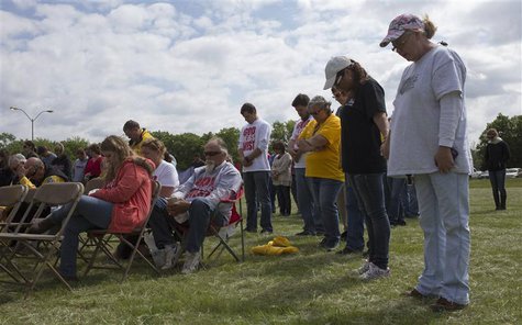 Church goers bow their heads in prayer during an open air Sunday service four days after a deadly fertilizer plant explosion in the town of Church goers bow their heads in prayer during an open air Sunday service four days after a deadly fertilizer plant explosion in the town of