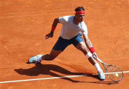 Rafael Nadal of Spain returns the ball to Novak Djokovic of Serbia during their final match at the Monte Carlo Masters in Monaco April 21, 2 Rafael Nadal of Spain returns the ball to Novak Djokovic of Serbia during their final match at the Monte Carlo Masters in Monaco April 21, 2