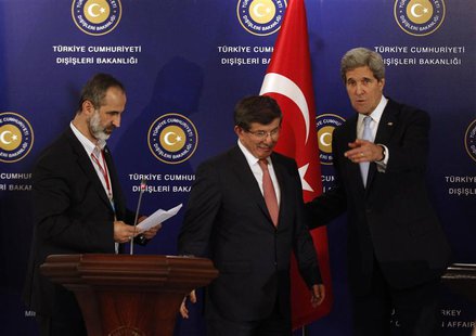 Turkish Foreign Minister Ahmet Davutoglu (C), U.S. Secretary of State John Kerry (R) and Syrian opposition leader Moaz al-Khatib leave a new Turkish Foreign Minister Ahmet Davutoglu (C), U.S. Secretary of State John Kerry (R) and Syrian opposition leader Moaz al-Khatib leave a new