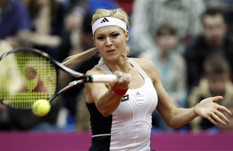 Russia's Maria Kirilenko hits a return against Slovakia's Daniela Hantuchova during their Fed Cup World Group semi-final tennis match in Mos Russia's Maria Kirilenko hits a return against Slovakia's Daniela Hantuchova during their Fed Cup World Group semi-final tennis match in Mos