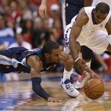 Los Angeles Clippers Chris Paul (R)and Memphis Grizzlies go after a loose ball during Game 1 of their NBA Western Conference Quarterfinals b