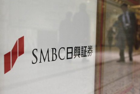 Passersby are reflected on the company logo of SMBC Nikko Securities Inc in Tokyo January 29, 2013. REUTERS/Shohei Miyano Passersby are reflected on the company logo of SMBC Nikko Securities Inc in Tokyo January 29, 2013. REUTERS/Shohei Miyano