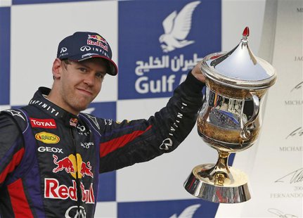 Red Bull Formula One driver Sebastian Vettel of Germany celebrates with the winner's trophy during the victory ceremony of the Bahrain F1 Gr Red Bull Formula One driver Sebastian Vettel of Germany celebrates with the winner's trophy during the victory ceremony of the Bahrain F1 Gr