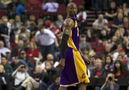 Los Angeles Lakers shooting guard Kobe Bryant (24) watches free throws at end of game against the Portland Trail Blazers during second half Los Angeles Lakers shooting guard Kobe Bryant (24) watches free throws at end of game against the Portland Trail Blazers during second half