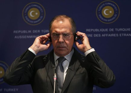 Russia's Foreign Minister Sergei Lavrov adjusts his earphones during a joint news conference with his Turkish counterpart Ahmet Davutoglu (n Russia's Foreign Minister Sergei Lavrov adjusts his earphones during a joint news conference with his Turkish counterpart Ahmet Davutoglu (n