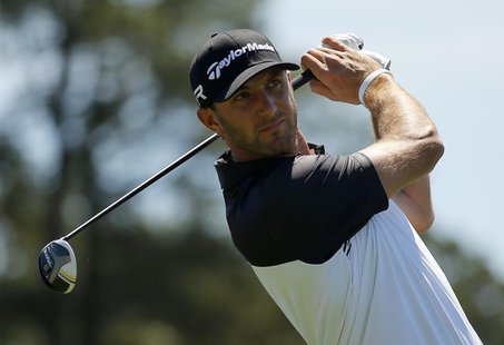 Dustin Johnson of the U.S. hits his tee shot on the first hole during third round play in the 2013 Masters golf tournament at the Augusta Na Dustin Johnson of the U.S. hits his tee shot on the first hole during third round play in the 2013 Masters golf tournament at the Augusta Na