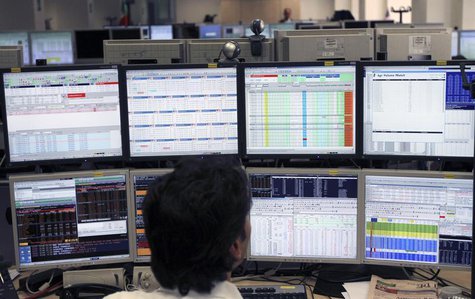 A trader works at Intesa Sanpaolo bank in Milan August 8, 2011. REUTERS/Stefano Rellandini A trader works at Intesa Sanpaolo bank in Milan August 8, 2011. REUTERS/Stefano Rellandini
