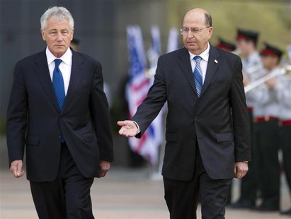 U.S. Defense Secretary Chuck Hagel (L) and his Israeli counterpart Moshe Yaalon walk together during an honour guard ceremony at the Kirya b U.S. Defense Secretary Chuck Hagel (L) and his Israeli counterpart Moshe Yaalon walk together during an honour guard ceremony at the Kirya b