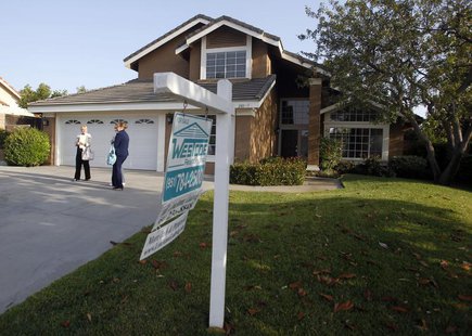 Realtor April Bolin (R) shows a home to Amy (L) and Eddie Deon during an upswing in the housing market, in Riverside, California May 24, 201 Realtor April Bolin (R) shows a home to Amy (L) and Eddie Deon during an upswing in the housing market, in Riverside, California May 24, 201
