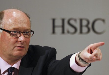 HSBC Group Chairman Douglas Flint attends a news conference after an informal meeting of local shareholders in Hong Kong May 21, 2012. REUTE HSBC Group Chairman Douglas Flint attends a news conference after an informal meeting of local shareholders in Hong Kong May 21, 2012. REUTE