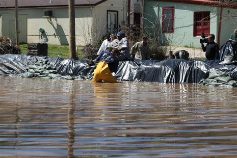 Residents and members of the National Guard build a flood wall against the rising Mississippi River in Clarksville, Missouri, in this April Residents and members of the National Guard build a flood wall against the rising Mississippi River in Clarksville, Missouri, in this April
