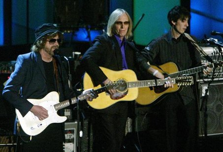 Rock greats Jeff Lynne (L) and Tom Petty play with Dhani Harrison (R), son of ex-Beatle George Harrison, at the 19th Annual Rock and Roll Ha Rock greats Jeff Lynne (L) and Tom Petty play with Dhani Harrison (R), son of ex-Beatle George Harrison, at the 19th Annual Rock and Roll Ha