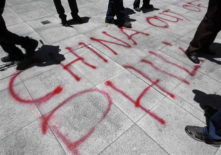 Graffiti done by activists is seen in front of the Chinese consulate demanding the withdrawal of Chinese ships from the disputed Scarborough Graffiti done by activists is seen in front of the Chinese consulate demanding the withdrawal of Chinese ships from the disputed Scarborough