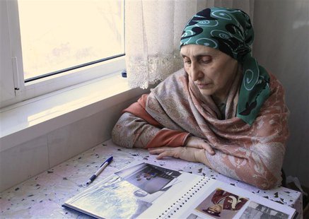 Patimat Suleimanova, aunt of Boston bombing suspects Dzhokhar and Tamerlan Tsarnaev, looks at photos from a family album at her house in Mak Patimat Suleimanova, aunt of Boston bombing suspects Dzhokhar and Tamerlan Tsarnaev, looks at photos from a family album at her house in Mak