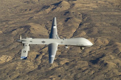 A U.S. Air Force MQ-1 Predator unmanned aerial vehicle assigned to the California Air National Guard's 163rd Reconnaissance Wing flies near A U.S. Air Force MQ-1 Predator unmanned aerial vehicle assigned to the California Air National Guard's 163rd Reconnaissance Wing flies near