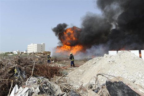Firefighters extinguish a fire started by anti-government protesters opposing the Bahrain Formula One Grand Prix in Manama April 21, 2013. P Firefighters extinguish a fire started by anti-government protesters opposing the Bahrain Formula One Grand Prix in Manama April 21, 2013. P