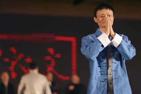 Jack Ma (R), the chairman of China's largest e-commerce firm Alibaba Group, gestures before giving a performance of Tai Chi at the Annual Su Jack Ma (R), the chairman of China's largest e-commerce firm Alibaba Group, gestures before giving a performance of Tai Chi at the Annual Su