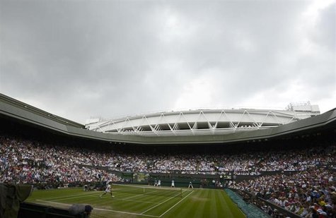 Rainclouds hang over Centre Court before a rain shower during the men's singles final tennis match between Andy Murray of Britain and Roger Rainclouds hang over Centre Court before a rain shower during the men's singles final tennis match between Andy Murray of Britain and Roger