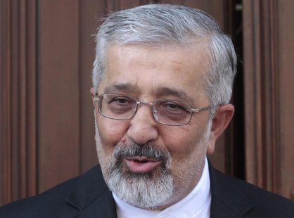 Iran's International Atomic Energy Agency (IAEA) ambassador Ali Asghar Soltanieh briefs the media as he arrives for talks at the Iranian emb Iran's International Atomic Energy Agency (IAEA) ambassador Ali Asghar Soltanieh briefs the media as he arrives for talks at the Iranian emb