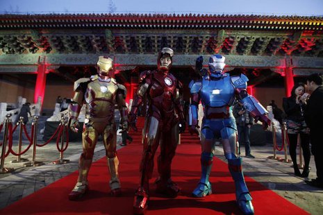 Performers dressed as Iron Man pose for a photo during a promotional event of the movie "Iron Man 3" before its release in China in early Ma Performers dressed as Iron Man pose for a photo during a promotional event of the movie "Iron Man 3" before its release in China in early Ma