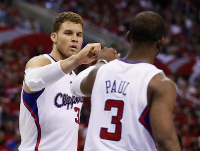 Los Angeles Clippers point guard Chris Paul (3) slaps hands with teammate Blake Griffin (32) during Game 2 of their NBA Western Conference Q Los Angeles Clippers point guard Chris Paul (3) slaps hands with teammate Blake Griffin (32) during Game 2 of their NBA Western Conference Q