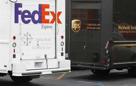 A Federal Express truck is parked next to a UPS truck as both drivers make deliveries in downtown San Diego, California March 5, 2013. REUTE A Federal Express truck is parked next to a UPS truck as both drivers make deliveries in downtown San Diego, California March 5, 2013. REUTE