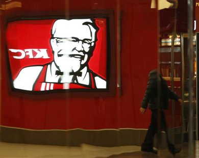 The logo of KFC restaurant is reflected on a metal wall at a shopping mall in Beijing, February 26, 2013. REUTERS/Kim Kyung-Hoon The logo of KFC restaurant is reflected on a metal wall at a shopping mall in Beijing, February 26, 2013. REUTERS/Kim Kyung-Hoon