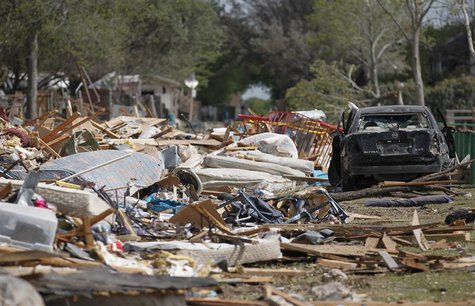 Debris from a destroyed housing complex lies near a damaged vehicle, next to the site of a deadly fertilizer plant explosion in the town of Debris from a destroyed housing complex lies near a damaged vehicle, next to the site of a deadly fertilizer plant explosion in the town of