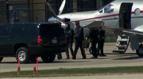 Canadian police escort suspect Chiheb Esseghaier from a plane to a truck after arriving in Markham, Ontario, April 22, 2013, in this still i Canadian police escort suspect Chiheb Esseghaier from a plane to a truck after arriving in Markham, Ontario, April 22, 2013, in this still i