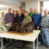 County Board members and others with model of Iron Range Veterans Memorial