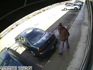 The suspect in Saturday's bank robbery is seen on surveillance footage. The suspect in Saturday's bank robbery is seen on surveillance footage.